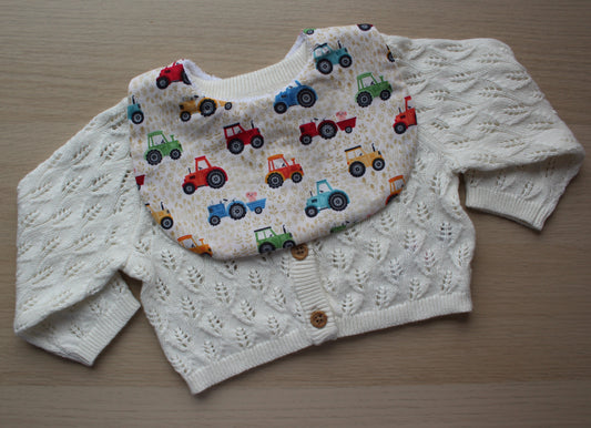 Baby bib with tractor theme