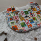 Alphabet themed baby bib with animal motifs