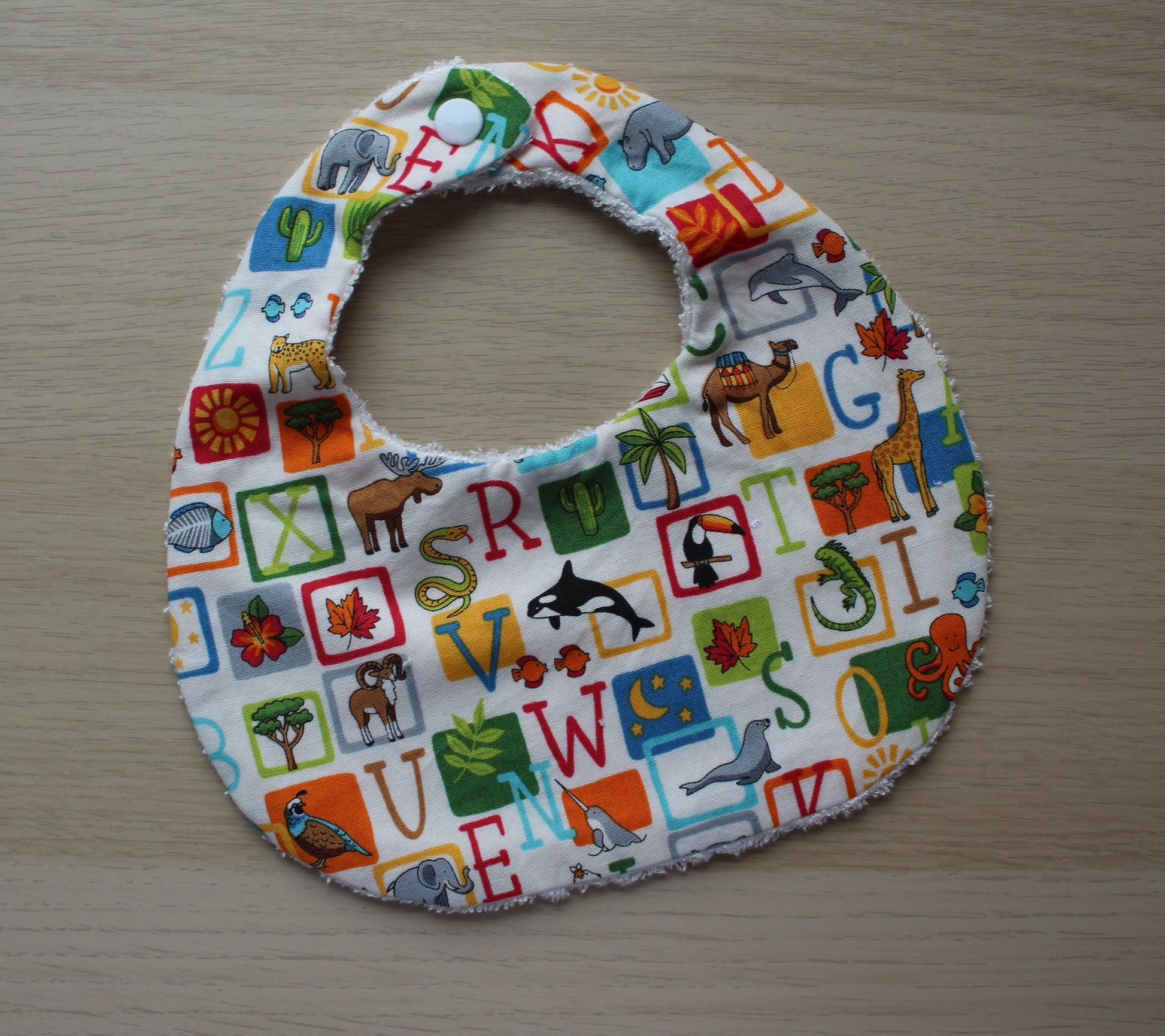 Animal and alphabet themed baby bib