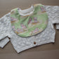 Rounded baby bib with cute little pig design