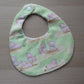 Pig baby bib with green background