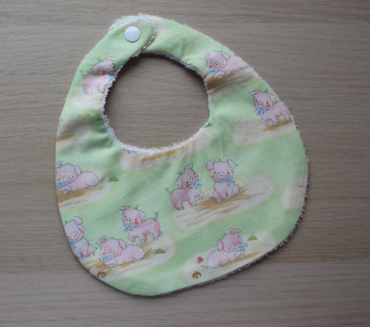Pig baby bib with green background