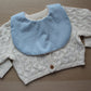 Baby bib featuring small stars on a blue background