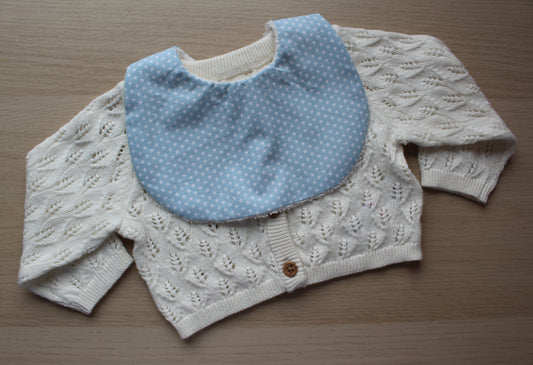 Baby bib featuring small stars on a blue background