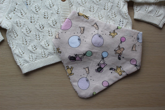 Dribble baby bib with winnie the pooh design