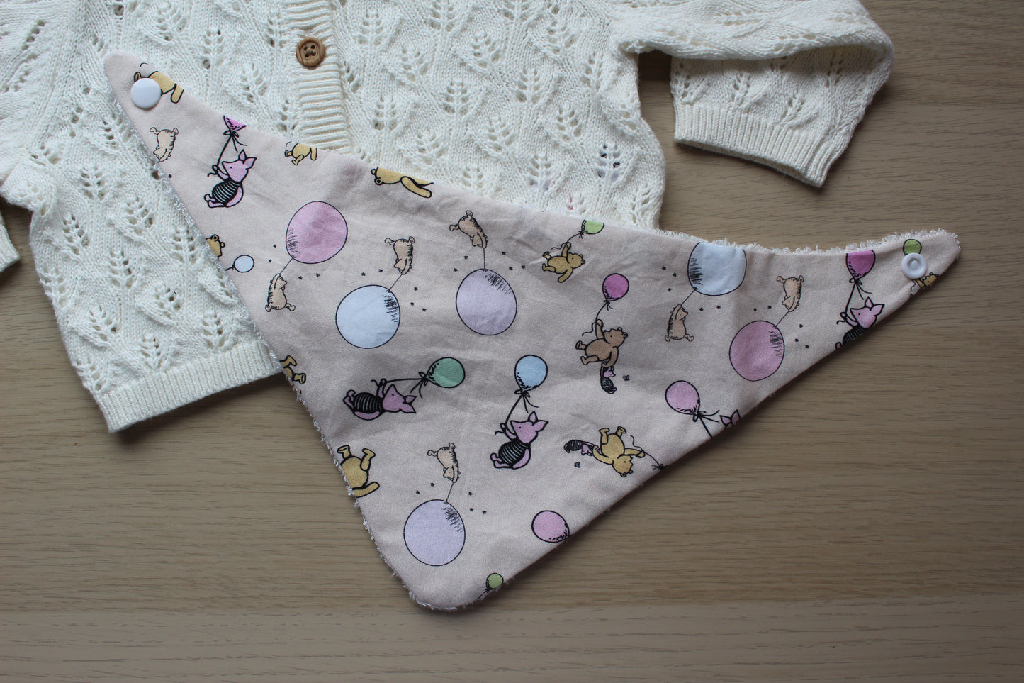 Baby bib with winnie the pooh theme
