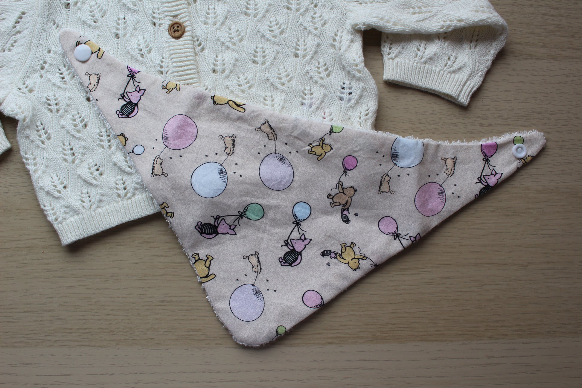 Baby bib with winnie the pooh theme