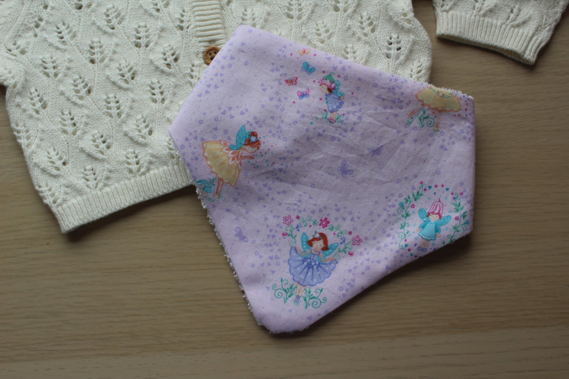 Purple dribble baby bib with fairies