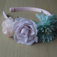 Floral headband with pale pink, purple and turquoise flowers