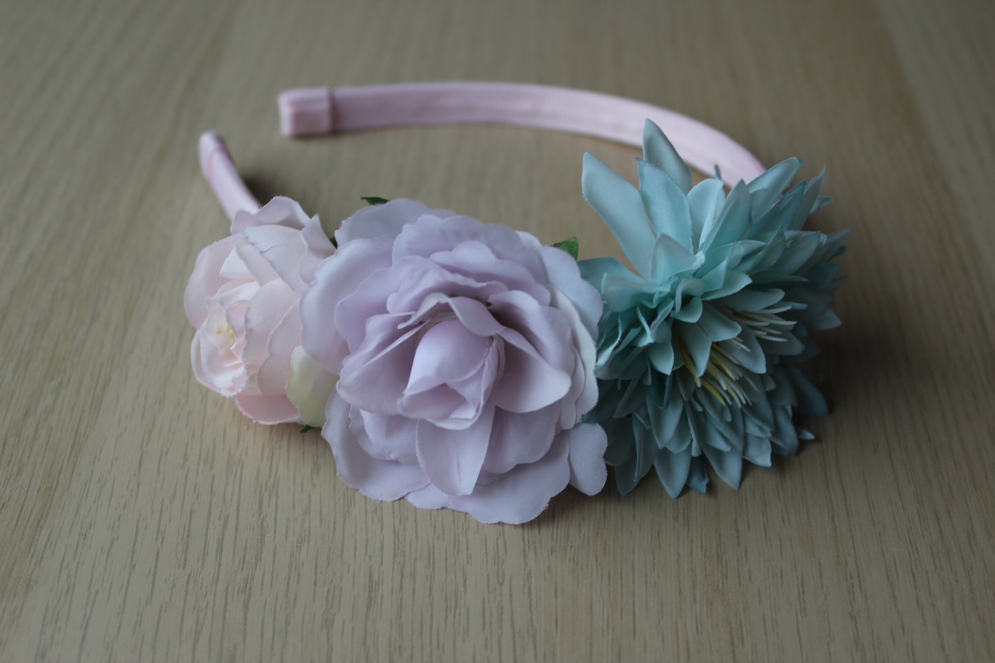 Floral headband with pale pink, purple and turquoise flowers