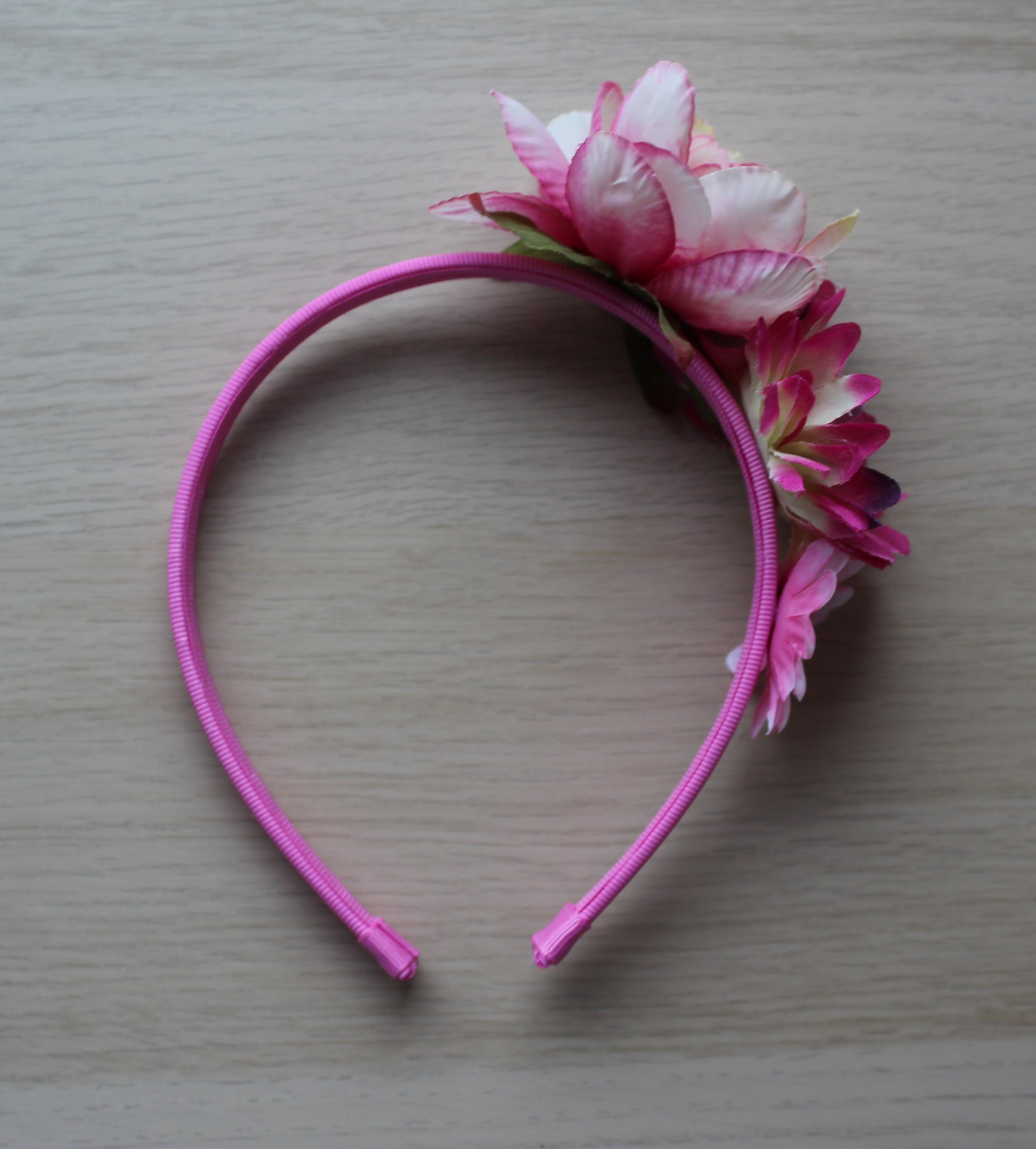 Pink headband with flower embellishments