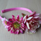 Floral headband with a mix of pink flowers