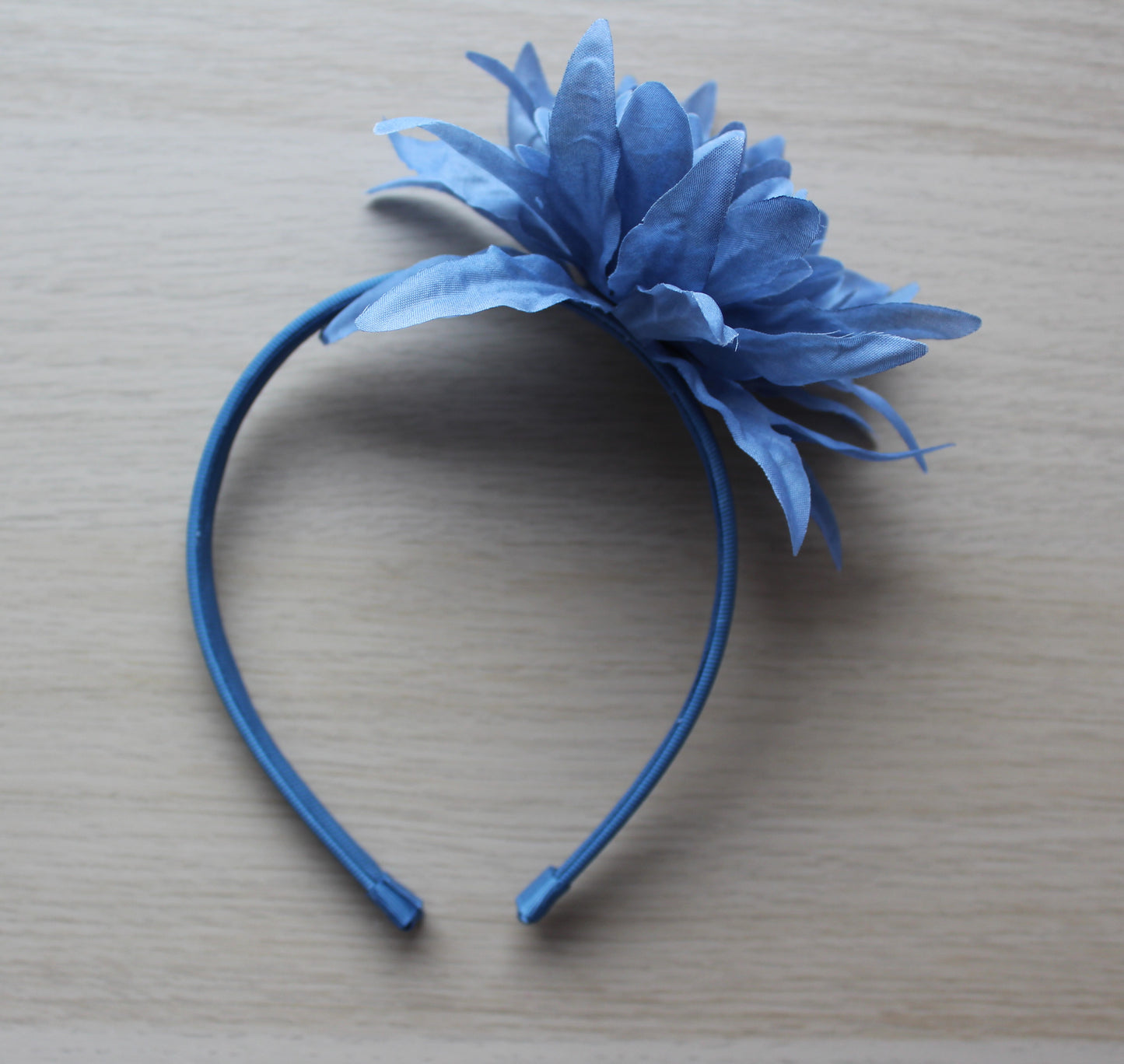 Headband in blue with large blue flower