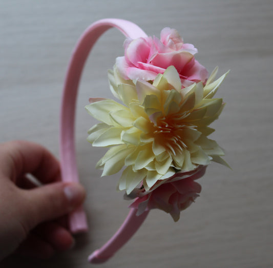 Pink headband with complimentary yellow and pink flowers
