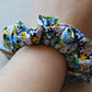 Floral scrunchie in black, blue and yellow