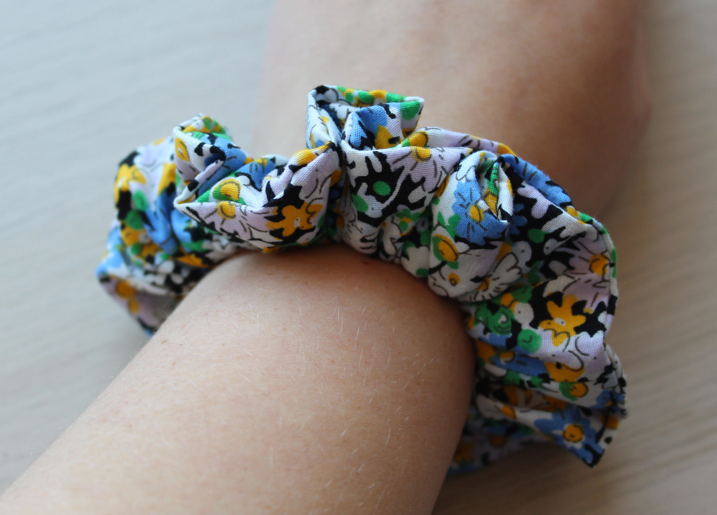 Floral scrunchie in black, blue and yellow
