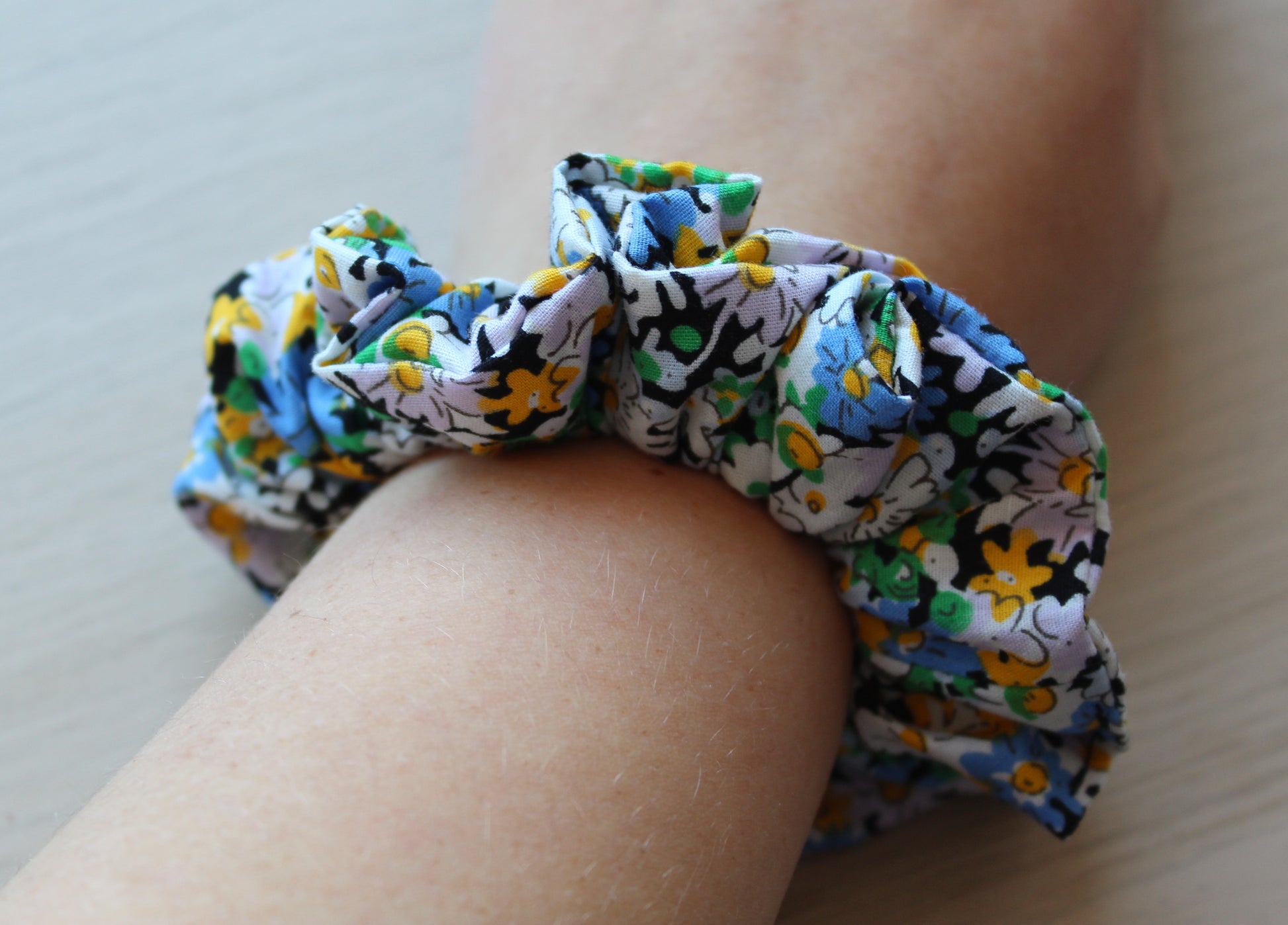Floral scrunchie in black, blue and yellow