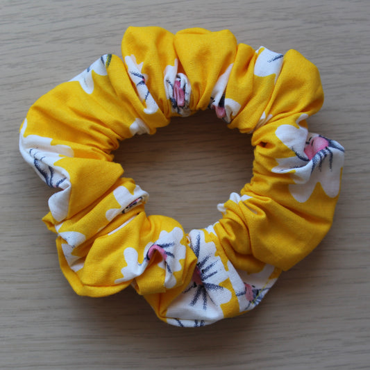Bright yellow scrunchie with daisies