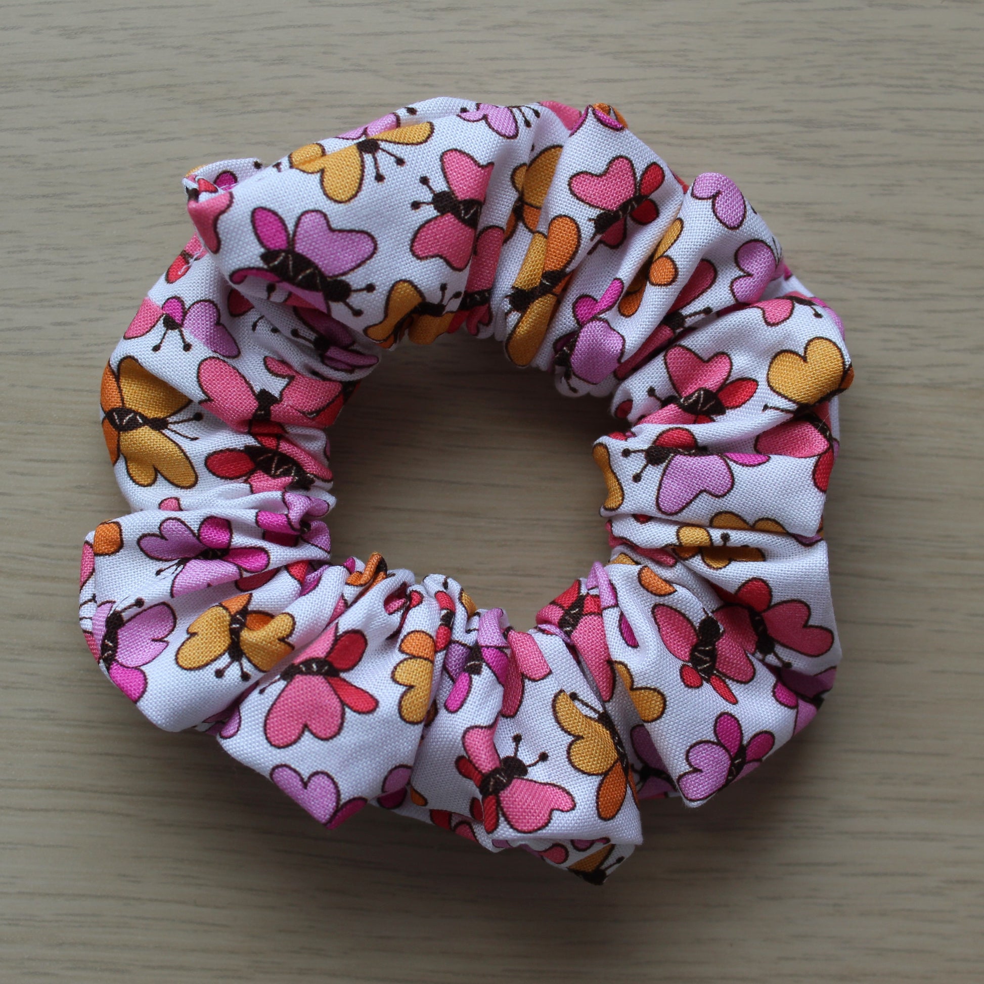 Scrunchie with bold pink and orange butterflies