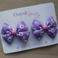 Pink and purple daisy bow hair clips