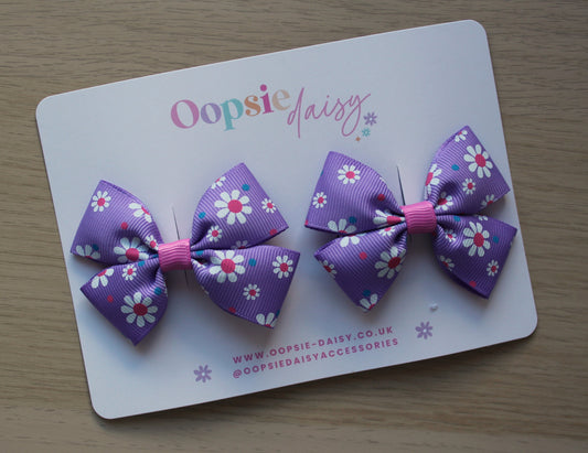 Pink and purple daisy bow hair clips
