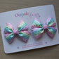 Pastel rainbow coloured bow hair clips with stars