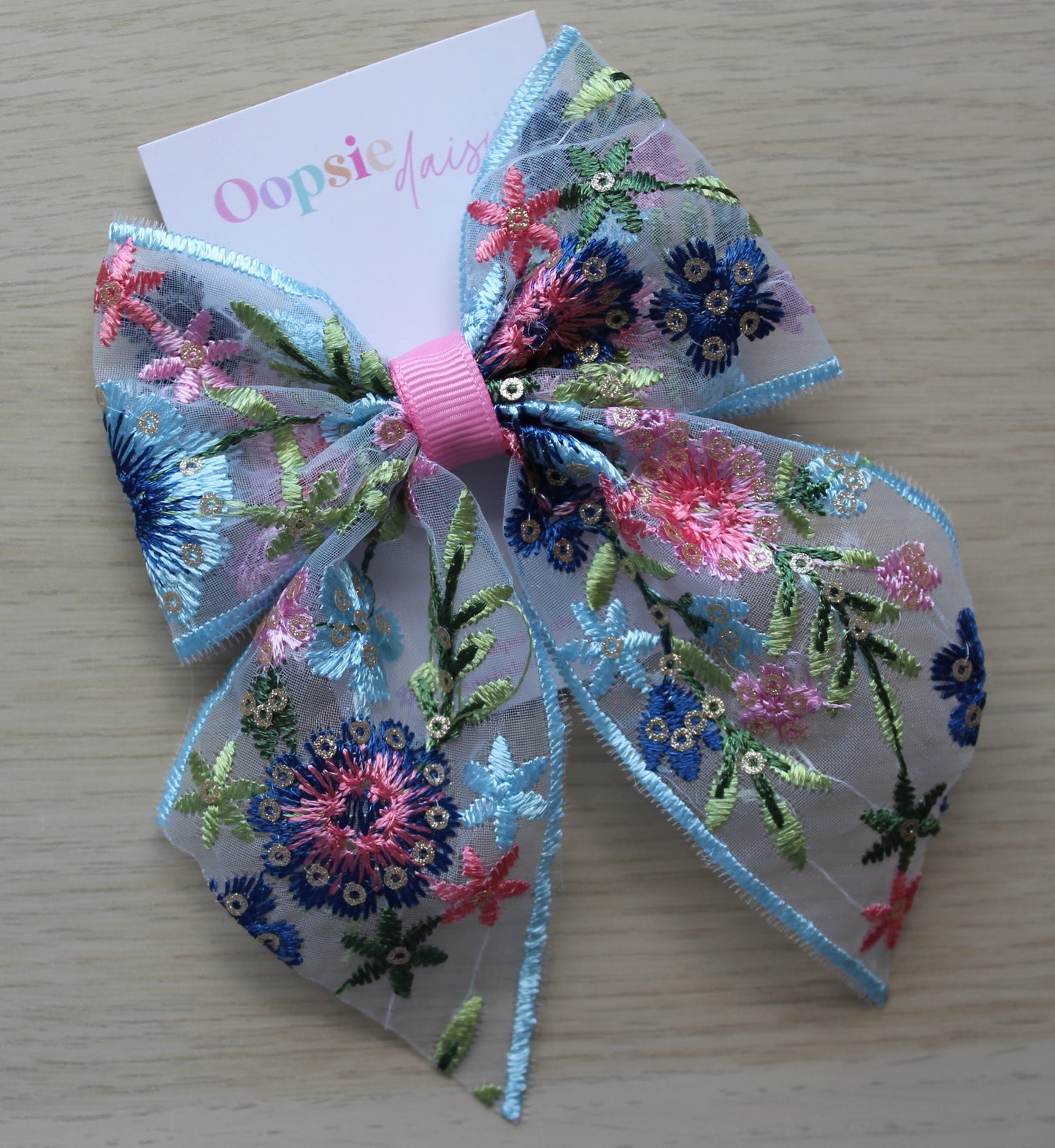 Blue and pink embroidered hair bow
