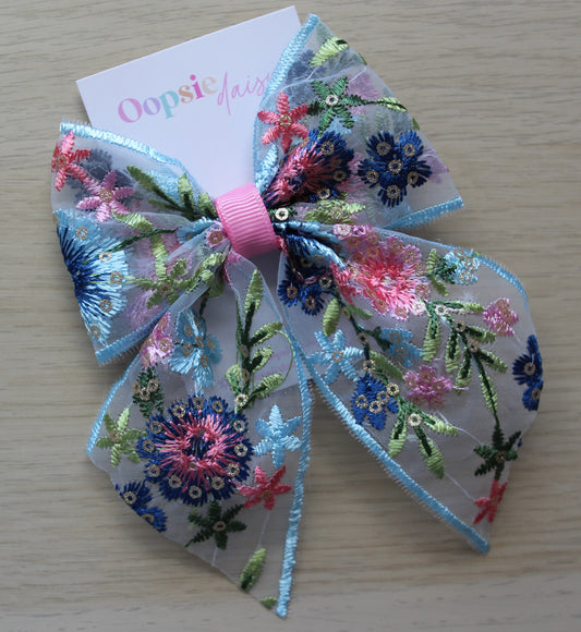 Blue and pink embroidered hair bow