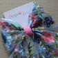 Hair bow with blue and pink floral embroidery
