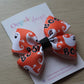 Orange and white hair bow with ghost and 'BOO' design 