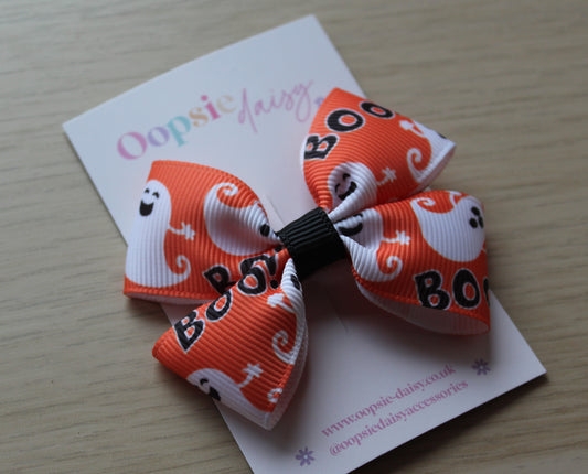 Orange and white hair bow with ghost and 'BOO' design 
