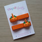 Adorable pumpkin themed hair clips