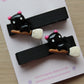 Halloween hair clips with black cat on broomstick