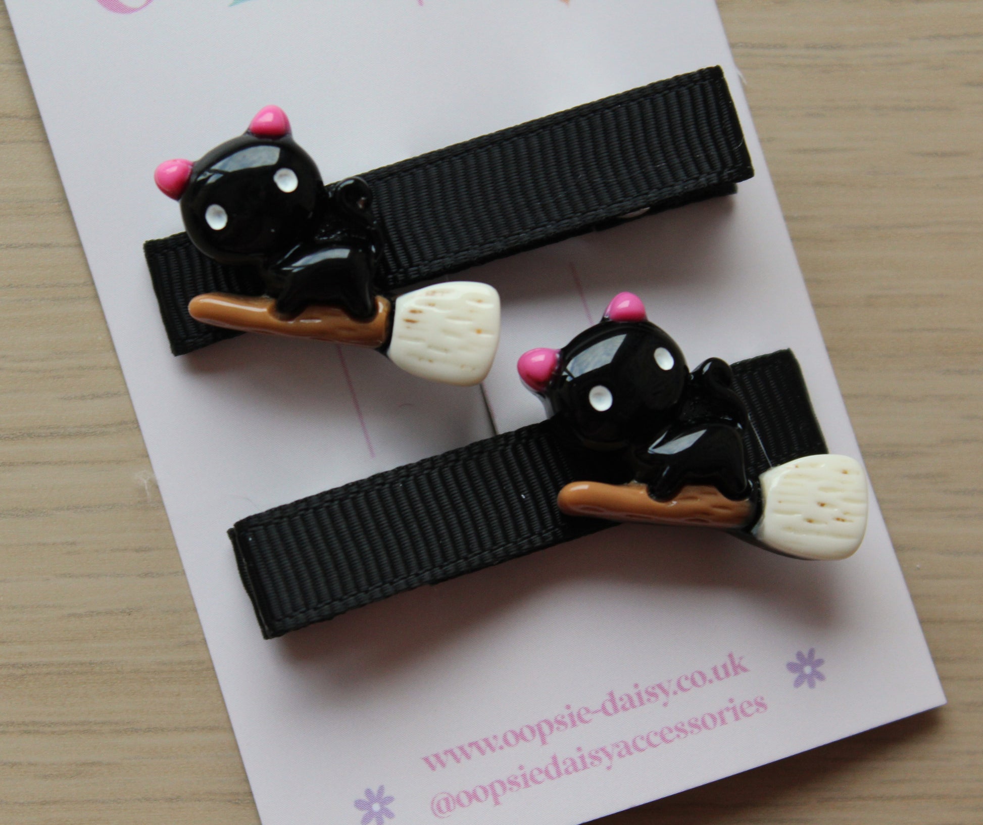 Halloween hair clips with black cat on broomstick