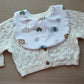 White baby bib with neutral baby animal design