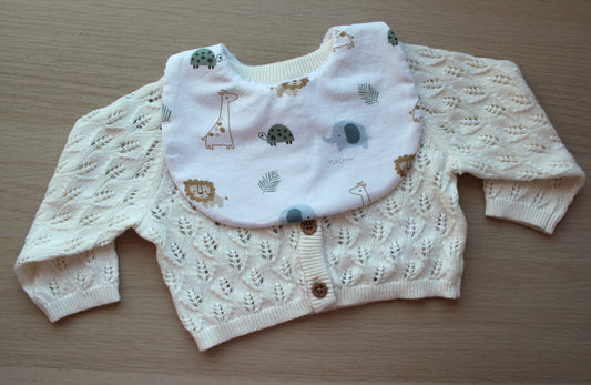 White baby bib with neutral baby animal design