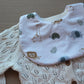 Baby bib with baby animal print on white background