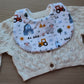 Baby bib with farm themed design