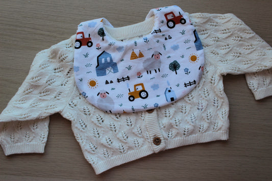 Baby bib with farm themed design