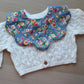 Colourful floral scallop baby bib