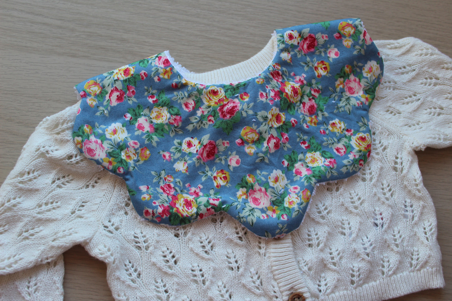 Scallop baby bib with beautiful rose pattern
