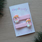 Pink Christmas hair clips with snowman