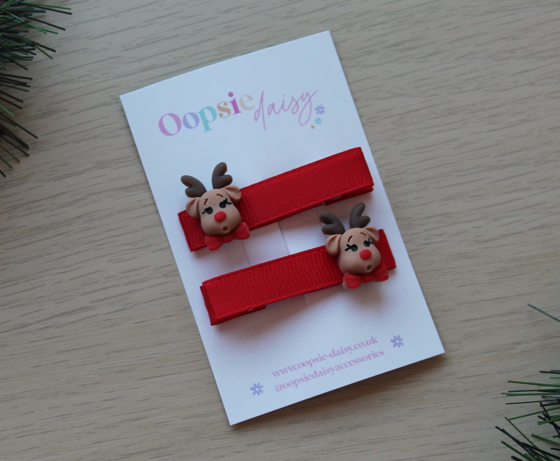 Red festive hair clips with Rudolph reindeer