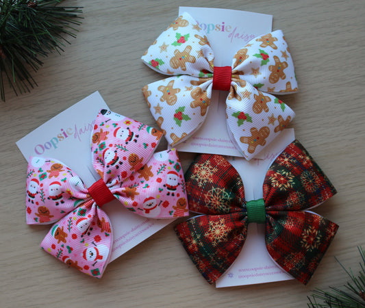 Christmas themed hair bows with santa, snowflakes and gingerbread man