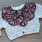 Red floral scallop baby bib