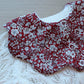 Scalloped baby bib in red floral design from Liberty