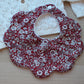 Scalloped shaped baby bib in red floral