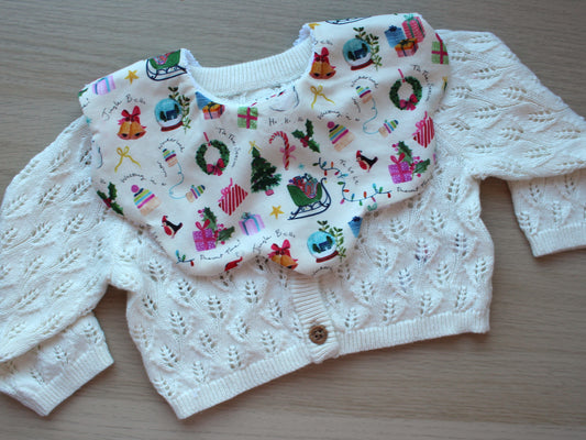 Baby bib with vintage festive design