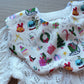 Scallop baby bib with christmas design