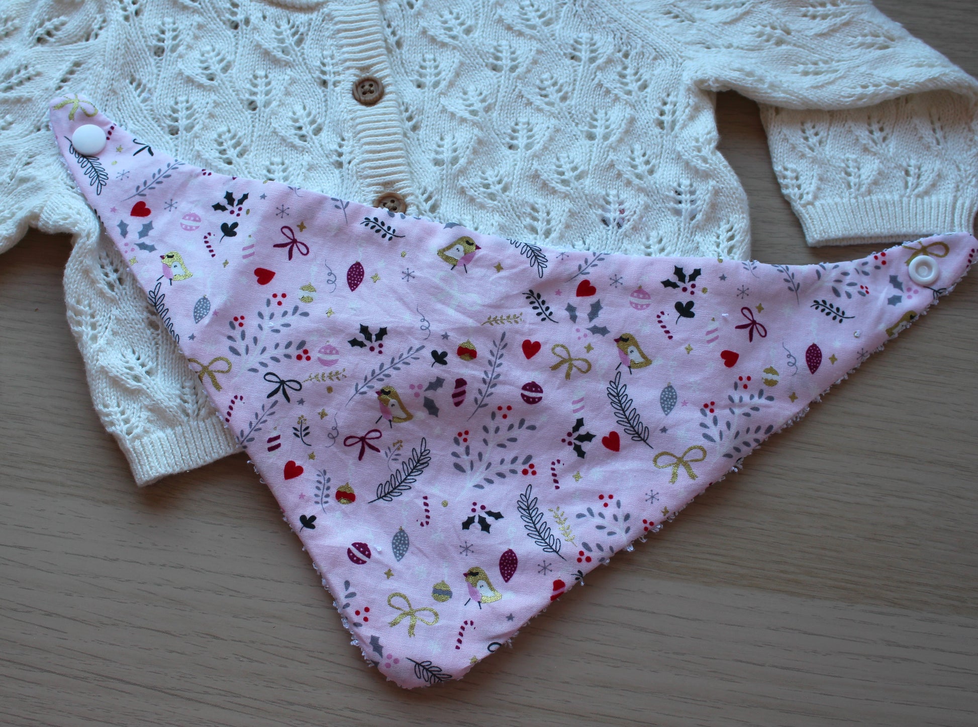 Baby bib with pink festive theme